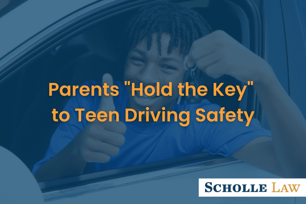 teenage boy smiling and holding car keys while in the driver's seat, Parents "Hold the Key" To Teen Driving Safety