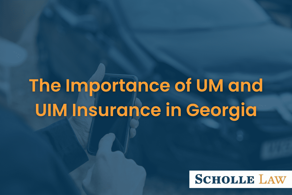 man using phone after a car accident, The Importance of UM and UIM Insurance in Georgia