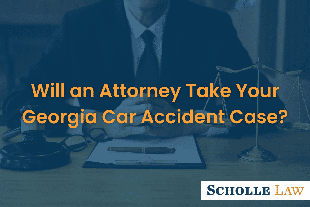 lawyer sitting at a table, Will an Attorney Take Your Georgia Car Accident Case