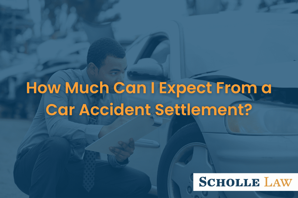 insurance adjuster inspecting a wrecked car, How Much Can I Expect From a Car Accident Settlement?