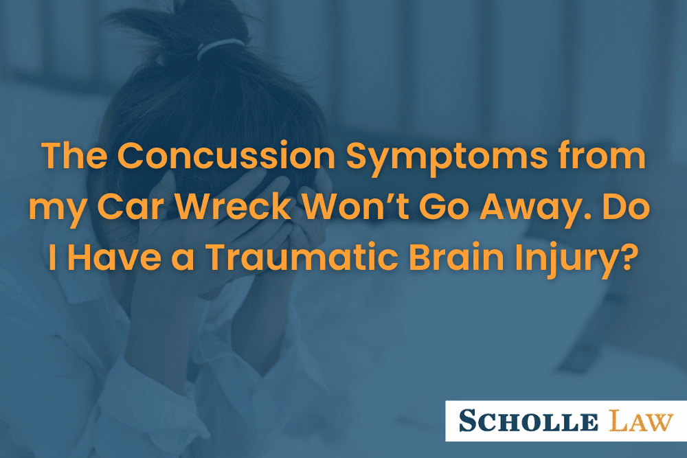 woman holding her head in pain, The Concussion Symptoms from my Car Wreck Won’t Go Away.  Do I Have a Traumatic Brain Injury?
