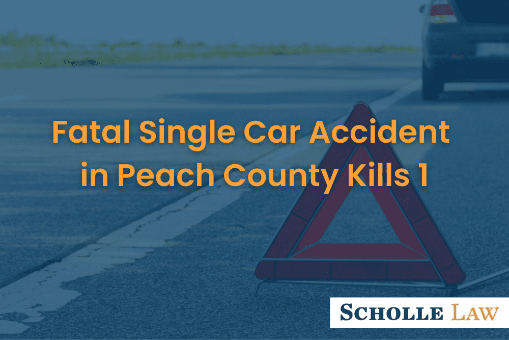 red triangle warning sign and broken car on a road, Fatal Single Car Accident in Peach County Kills 1