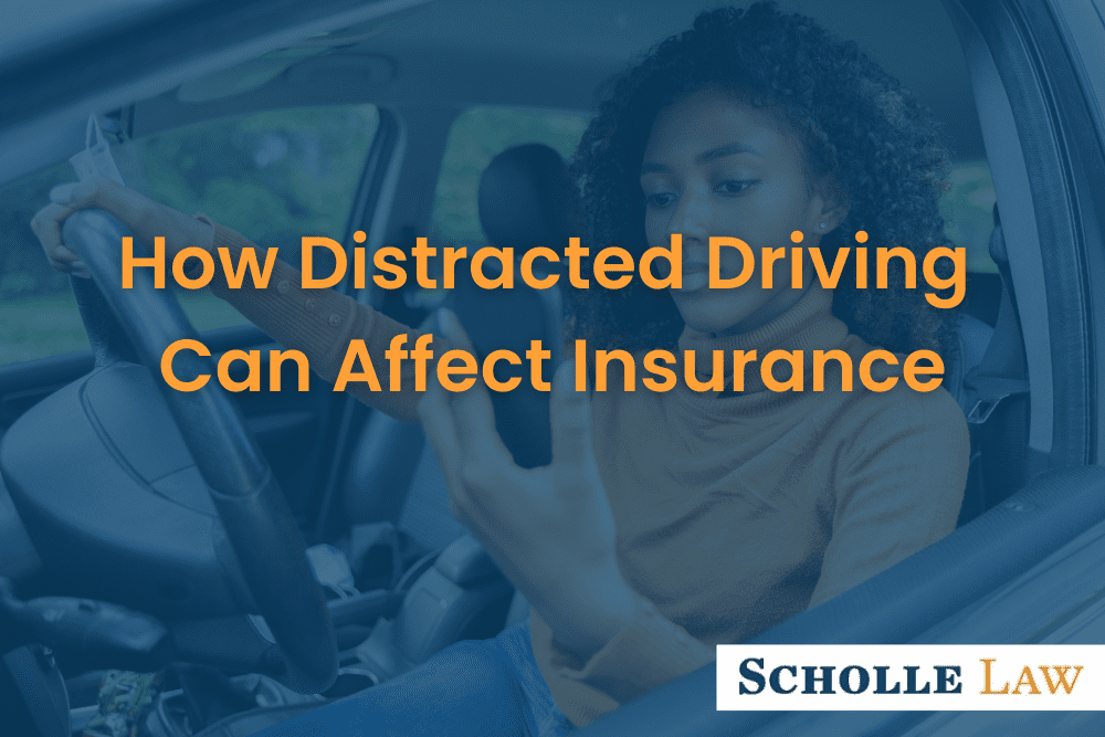 woman looking at phone while driving, How Distracted Driving Can Affect Insurance