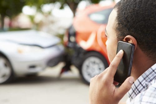 Male Driver Making Phone Call After Traffic Accident