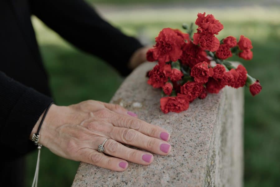 Woman Touching a Headstone