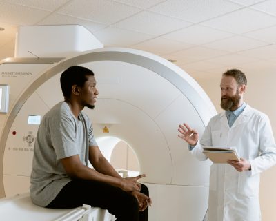 doctor talking to patient after m-r-i or c-t scan