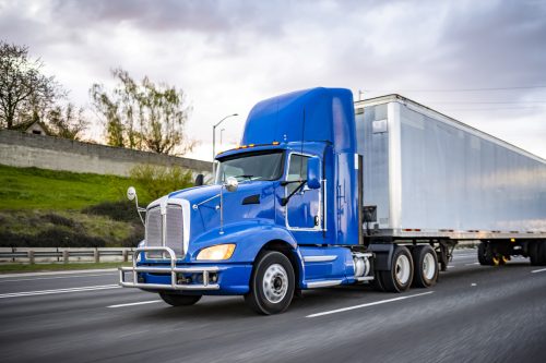 Day cab blue big rig industrial semi trucks tractor with roof spoiler 