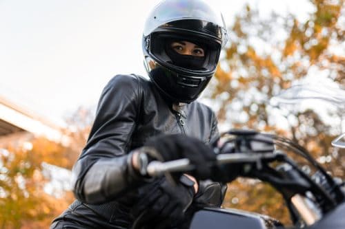 Portrait of female motorcyclist in helmet