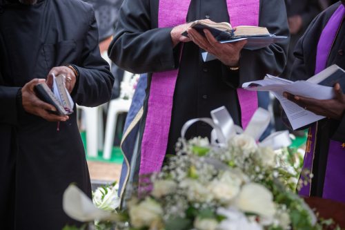Three Anglican priests attending a funeral