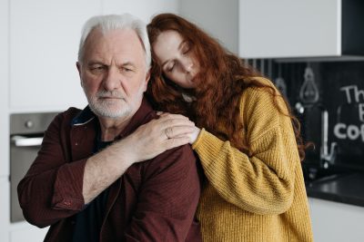 Father and daughter comforting each other