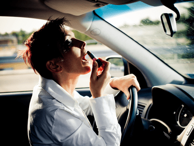 applying lipstick while driving