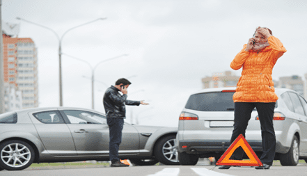 people on the phone after a car accident