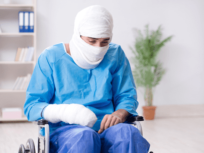 man in casts sitting in a wheel chair