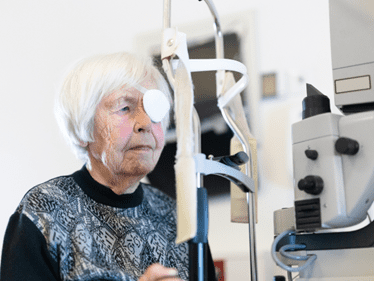 elder women with eye bandage