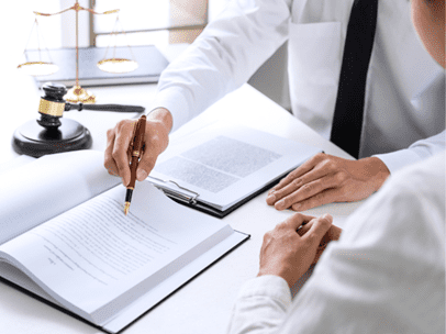 lawyer reviewing paperwork with a client