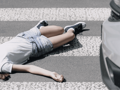 woman laying in the cross walk after being hit by a car