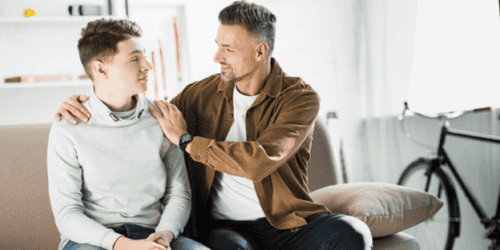 Parent talking to teen driver about safe driving habits