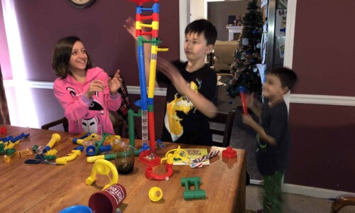 In the Community 18 Christmas Wish recipients setting up their new game