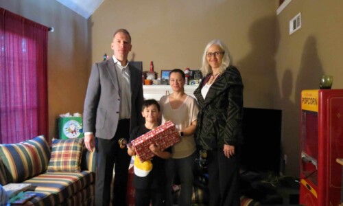 In the Community 16 Delivering gifts to Christmas Wish family