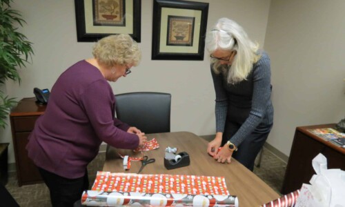 In the Community 14 Scholle Law staff wrapping Christmas gifts